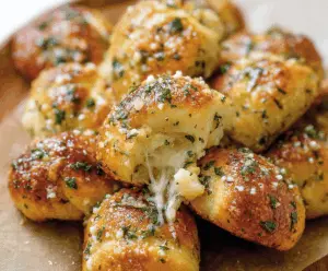 Delicious cheesy garlic knots fresh out of the oven, perfect for snacking or sharing with friends.