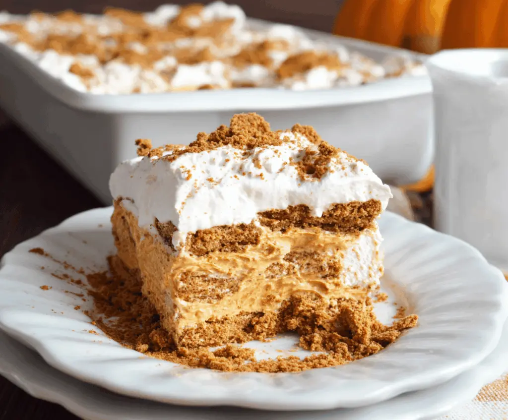 Delicious Gingersnap Pumpkin Icebox Cake layered with whipped cream and gingersnap cookies, perfect for fall desserts