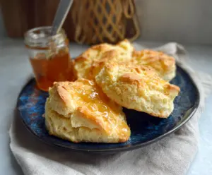 Delicious homemade lofty biscuits fresh out of the oven, perfect for breakfast or brunch.